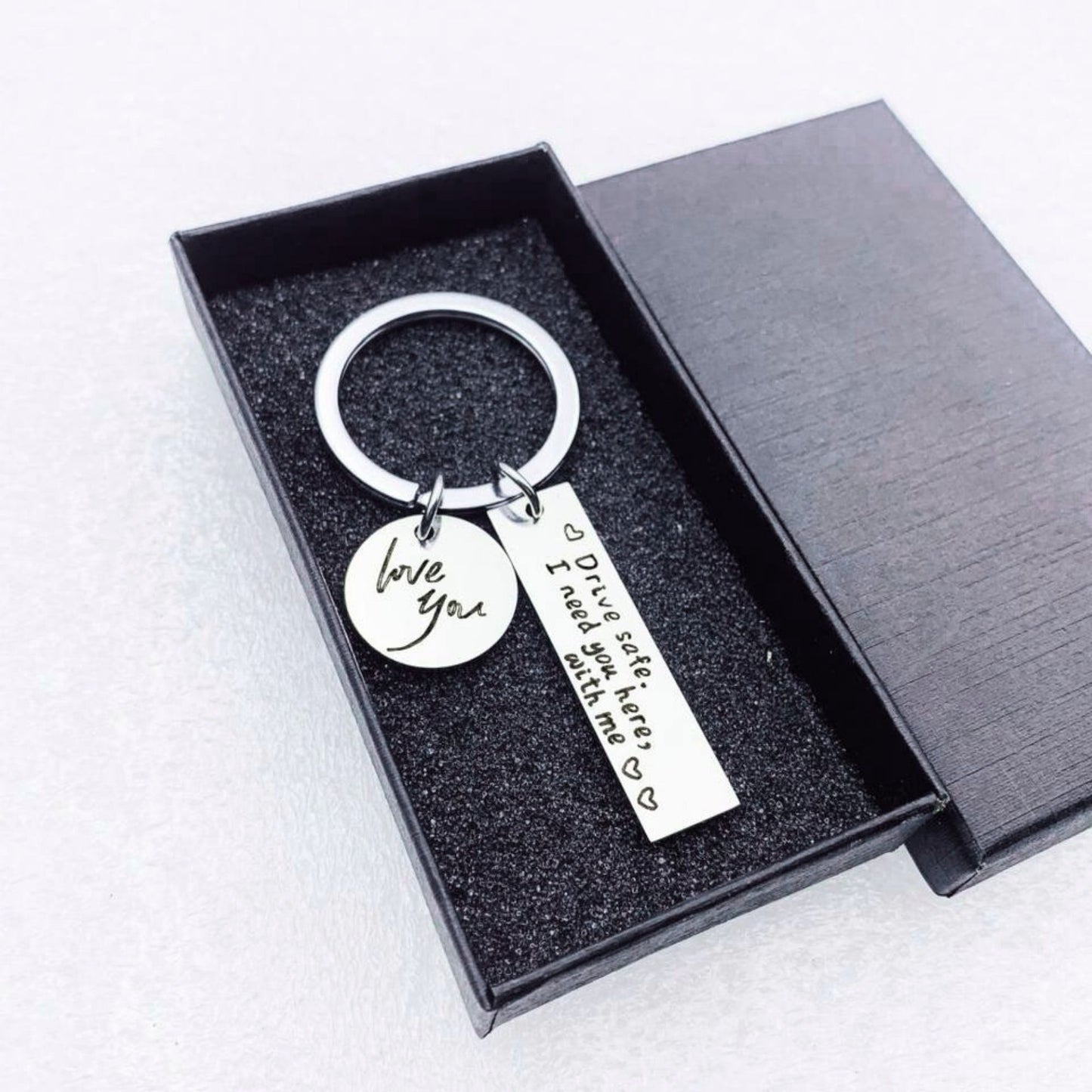 Black engraved Drive Safe keychain – meaningful road safety symbol